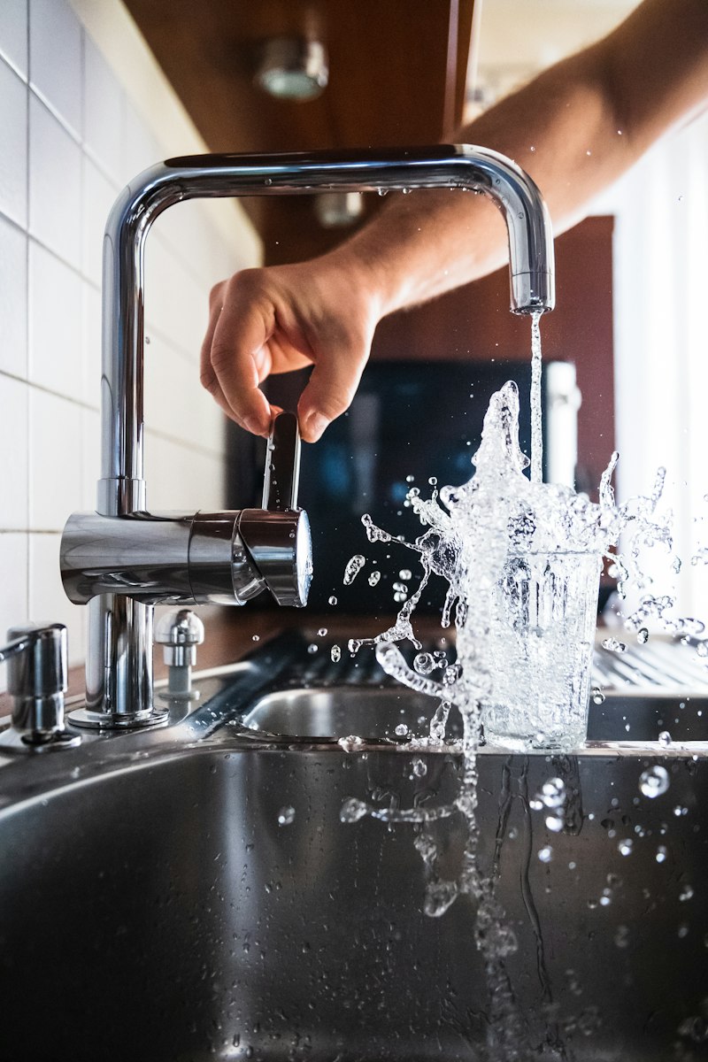 Plumber working on pipes