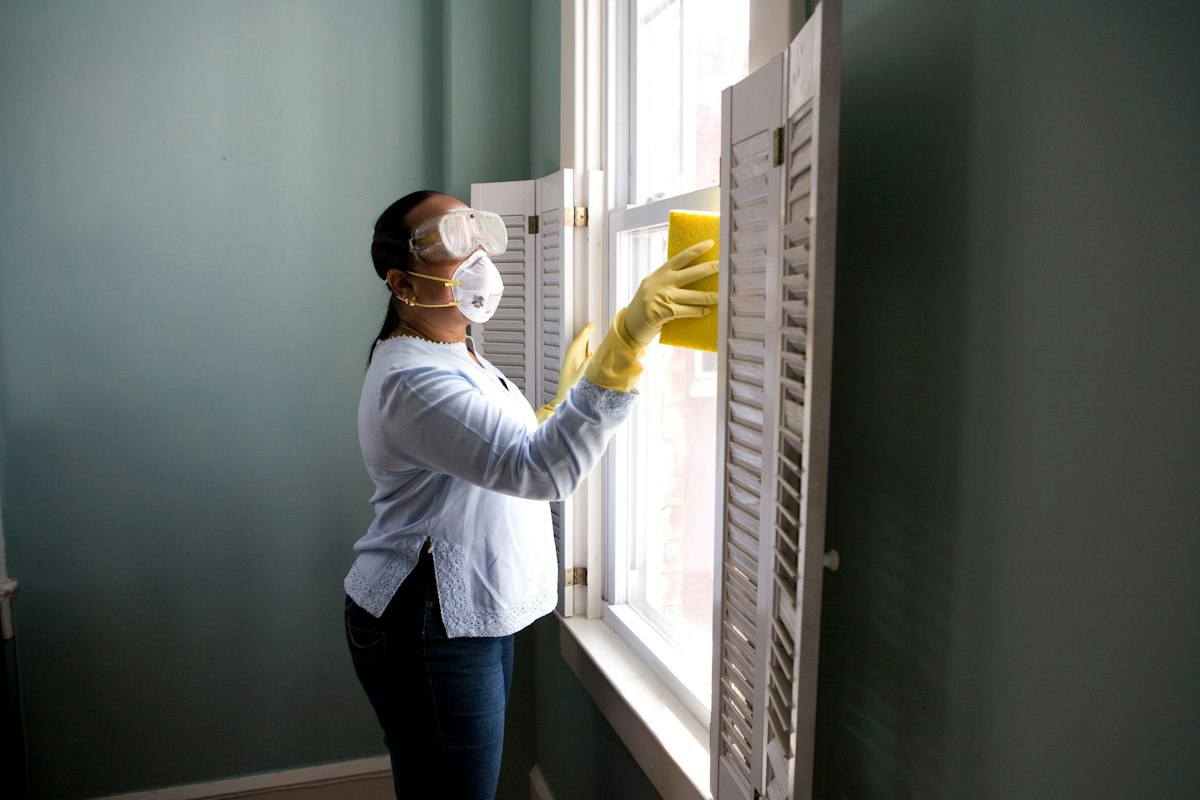 Technician clearing a household drain line